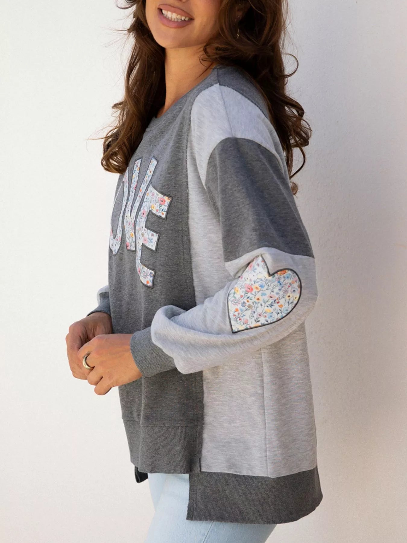 Exposed Seam Patchwork Uneven Hem LOVE Graphic Sweatshirt - Be Bliss Boutique