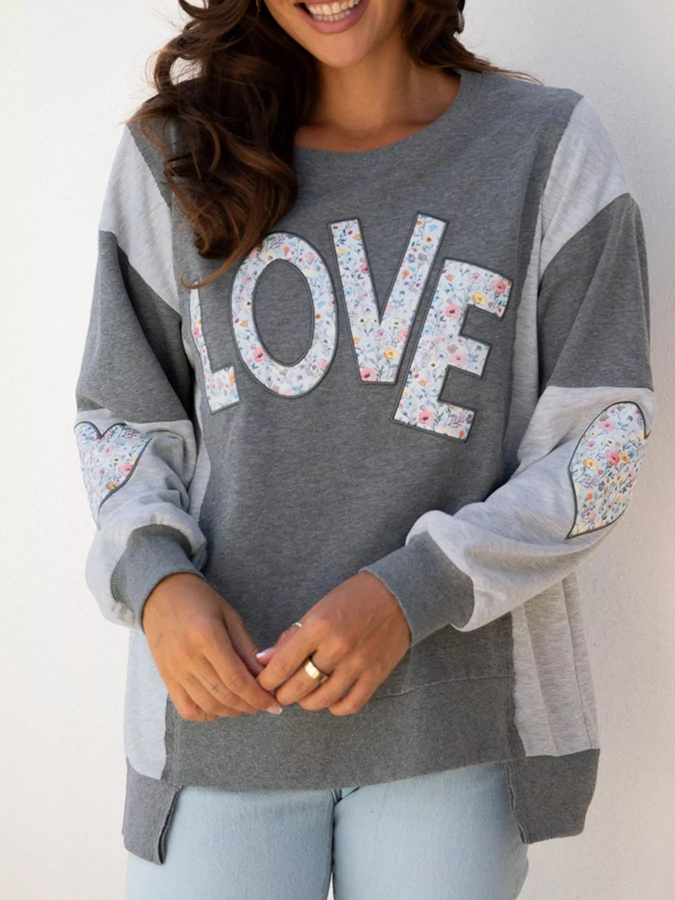 Exposed Seam Patchwork Uneven Hem LOVE Graphic Sweatshirt - Be Bliss Boutique