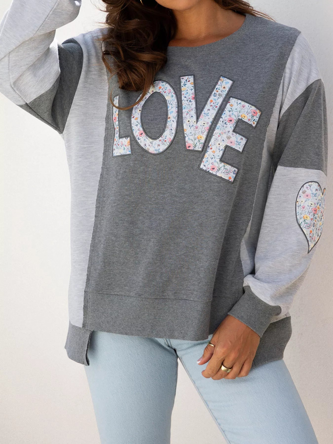 Exposed Seam Patchwork Uneven Hem LOVE Graphic Sweatshirt - Be Bliss Boutique