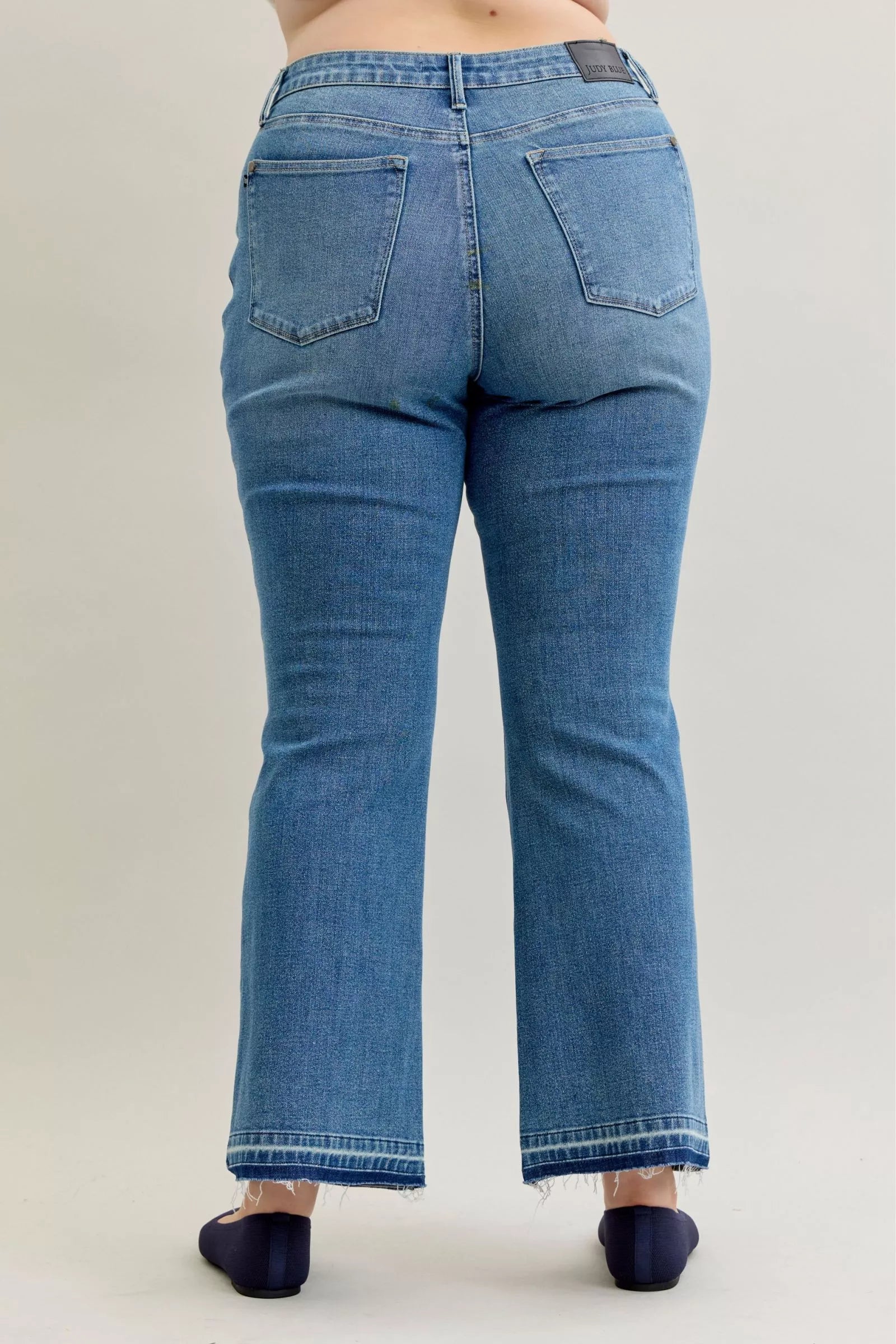 Judy Blue Jeans - Full Size Mid Rise Slim Bootcut Tummy Control Release Hem Jeans - Be Bliss Boutique